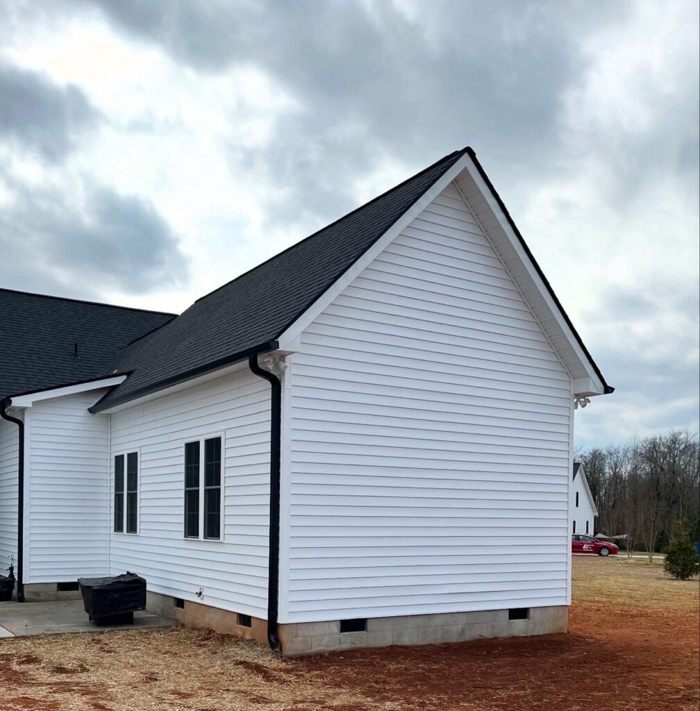 Side gable view of Lavender Farm Trail in-law suite addition tied into existing home