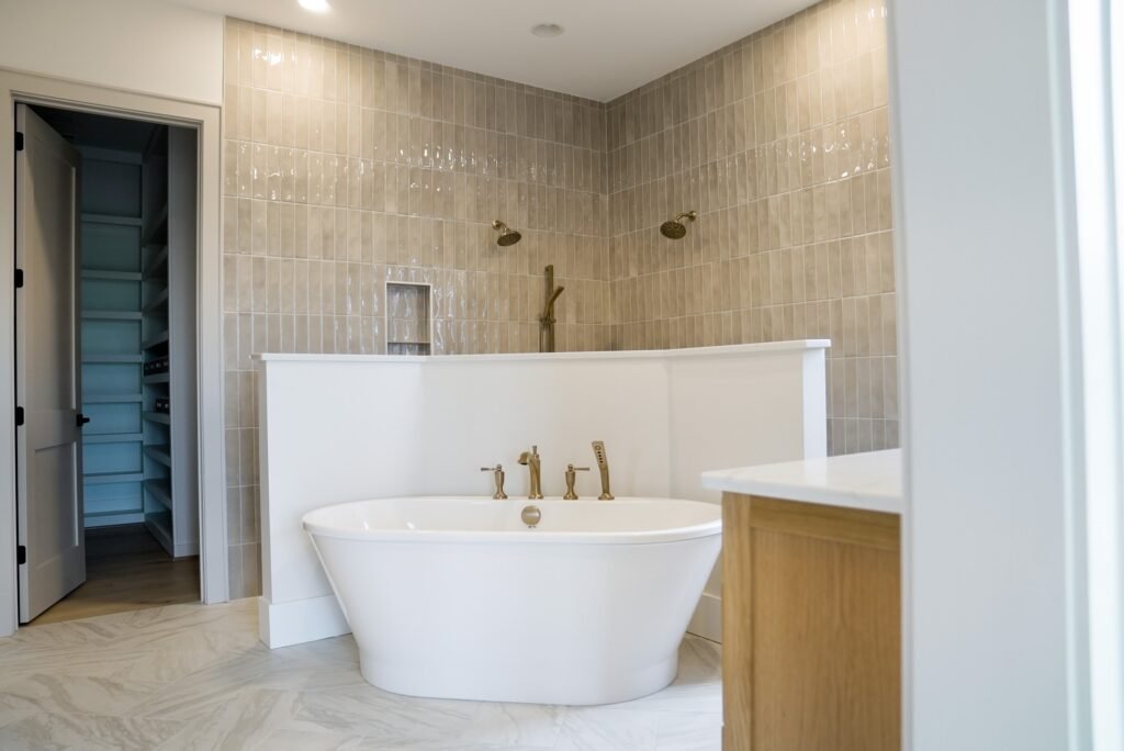 Primary bath with a freestanding soaking tub and tiled walk-in shower