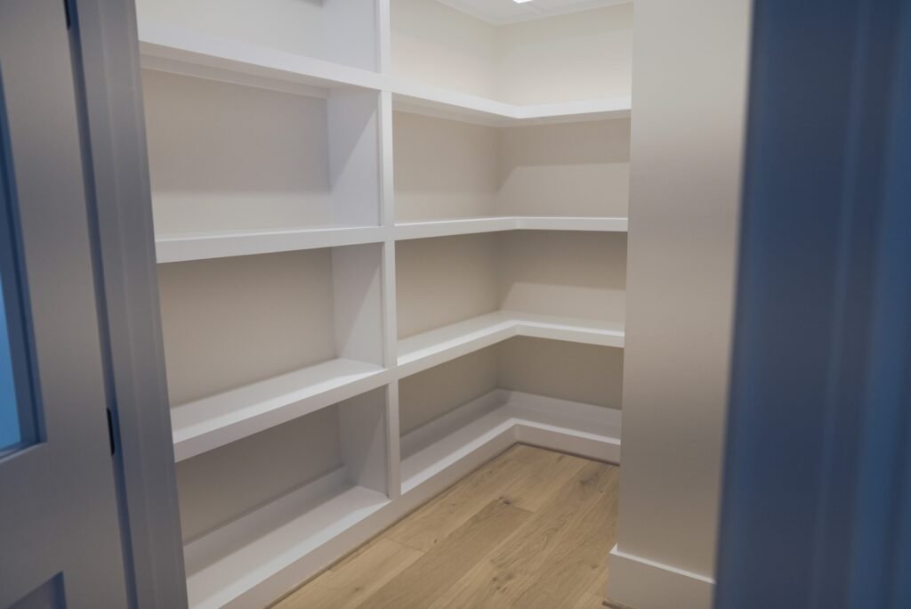 Custom closet with built-in shelving in the Jack Davis home