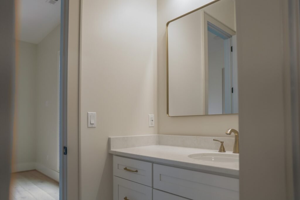 Bathroom in the Jack Davis custom home with tile and marble finishes