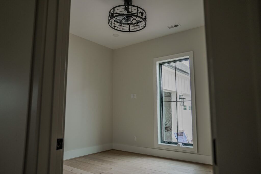 Bedroom in the Jack Davis custom home with white oak floors