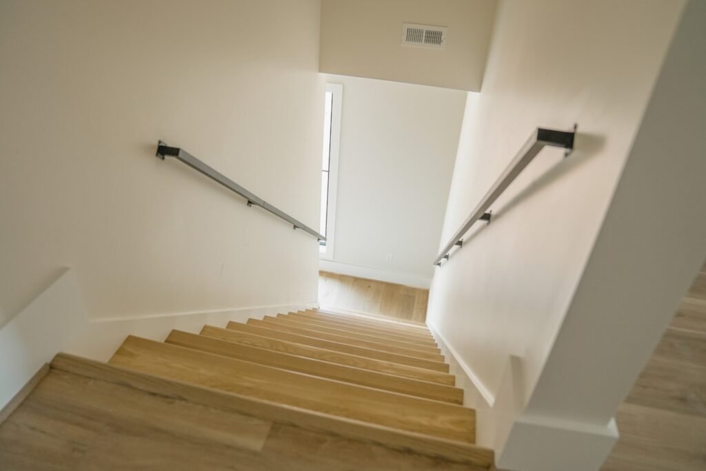Open-riser staircase with white oak treads in the Jack Davis custom home