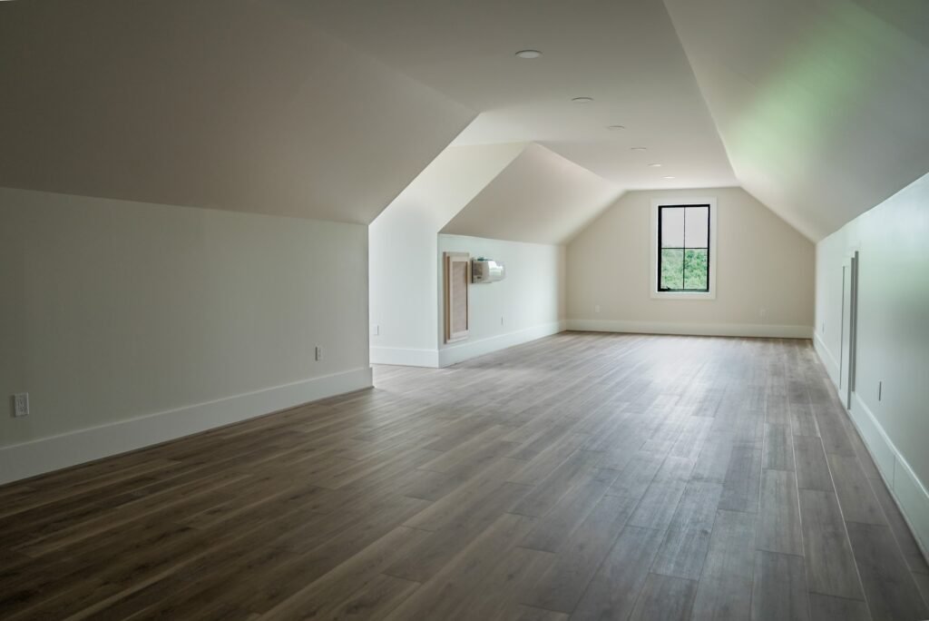 Bedroom in the Jack Davis custom home with white oak floors