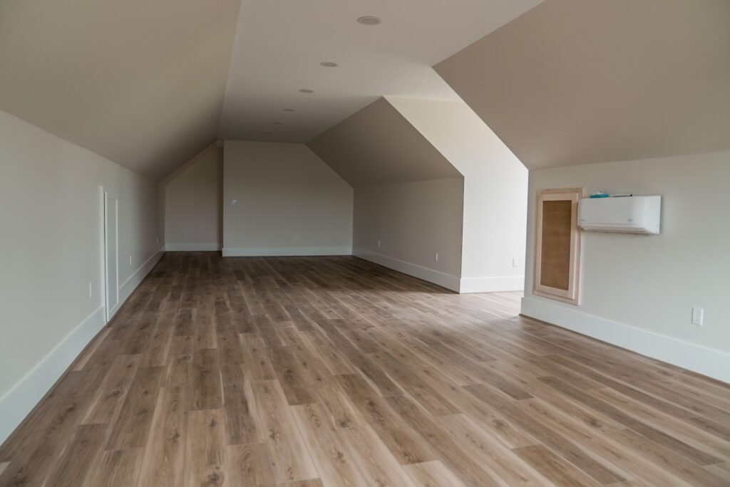 Bedroom in the Jack Davis custom home with white oak floors
