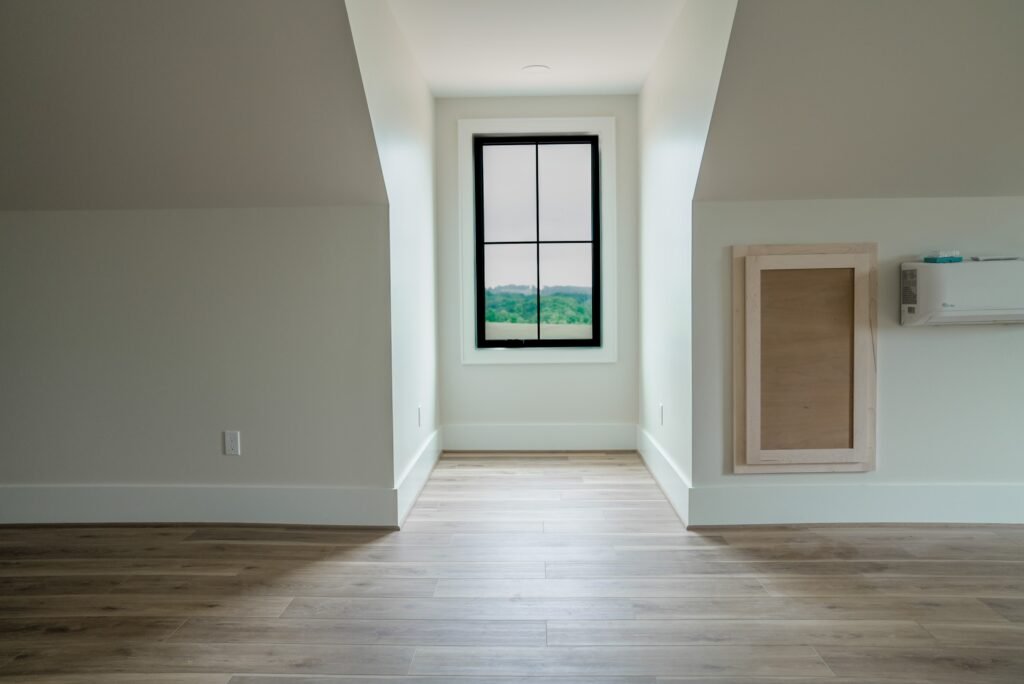 Bedroom in the Jack Davis custom home with white oak floors