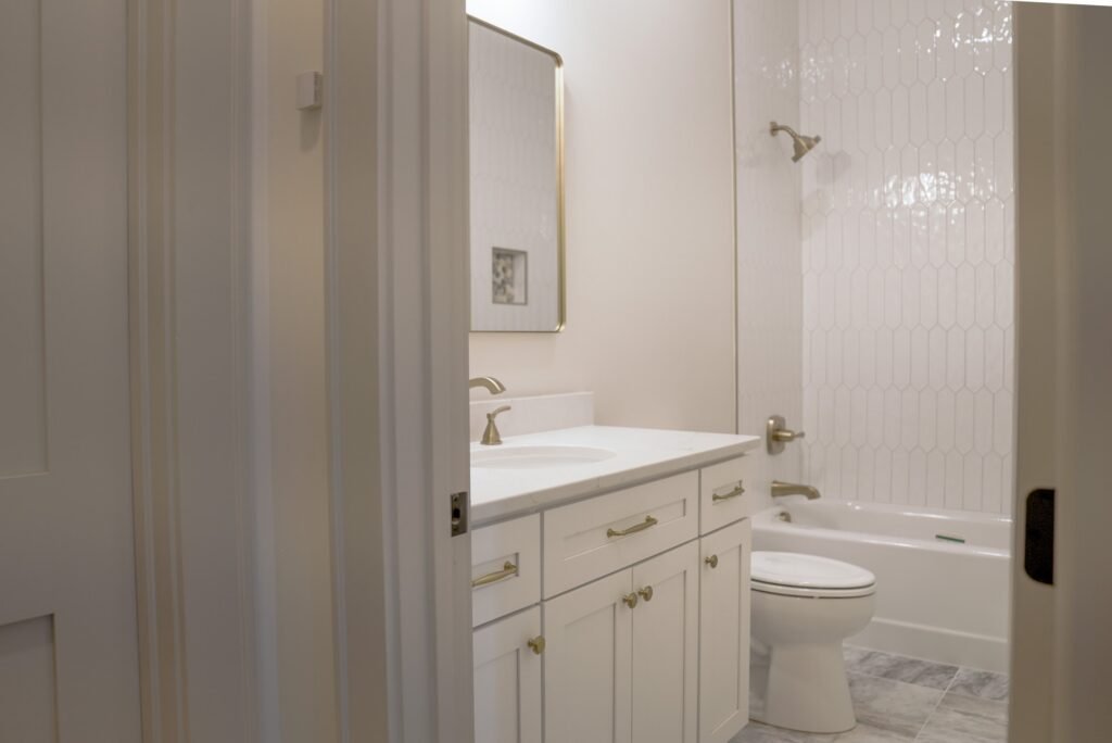 Bathroom in the Jack Davis custom home with tile and marble finishes