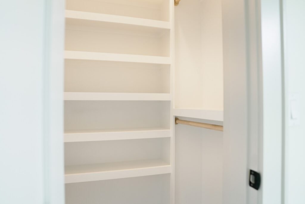 Custom closet with built-in shelving in the Jack Davis home