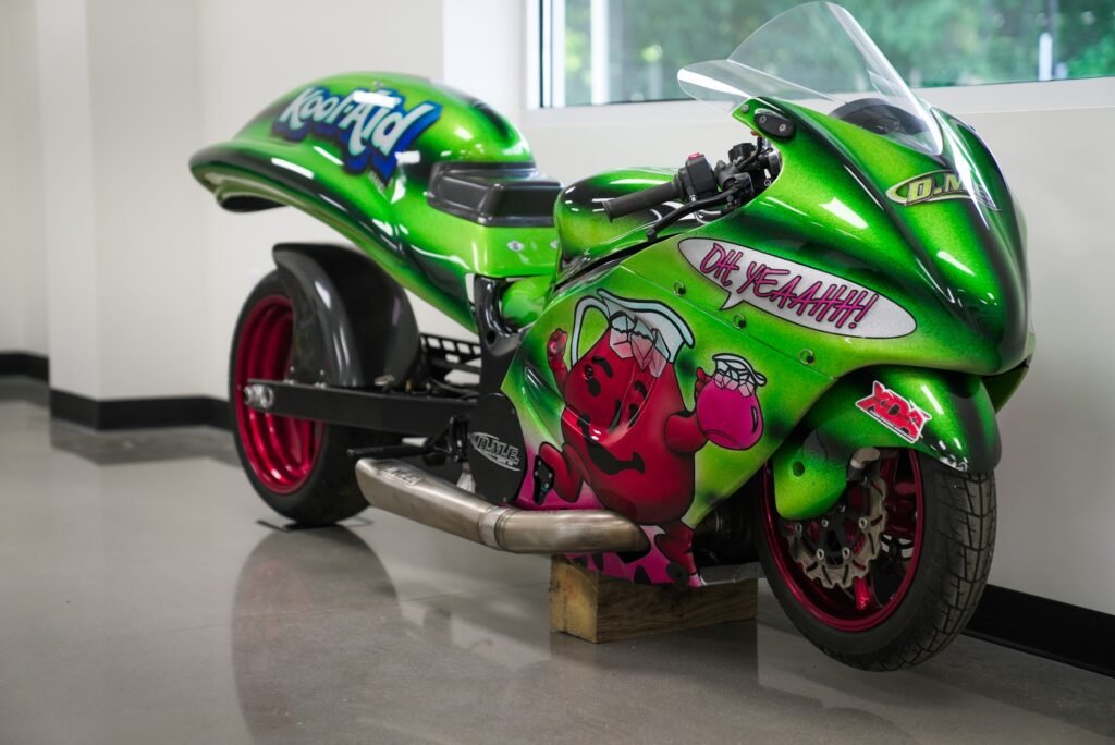 DME Racing's custom Kool-Aid green drag racing motorcycle in the finished showroom