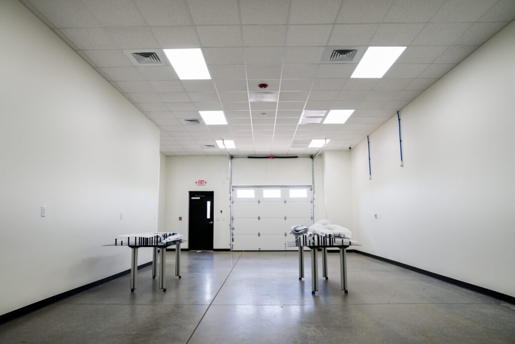 Interior bay with roll-up doors and a polished concrete floor
