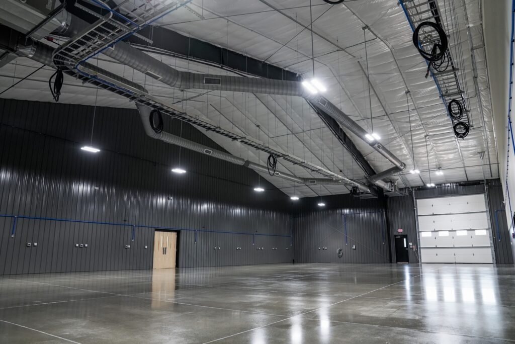 Wide view of the shop floor with high ceilings and recessed lighting