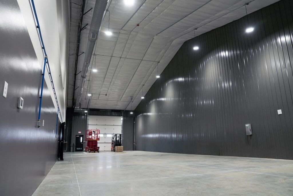 Metal-clad service bay with a sealed concrete floor