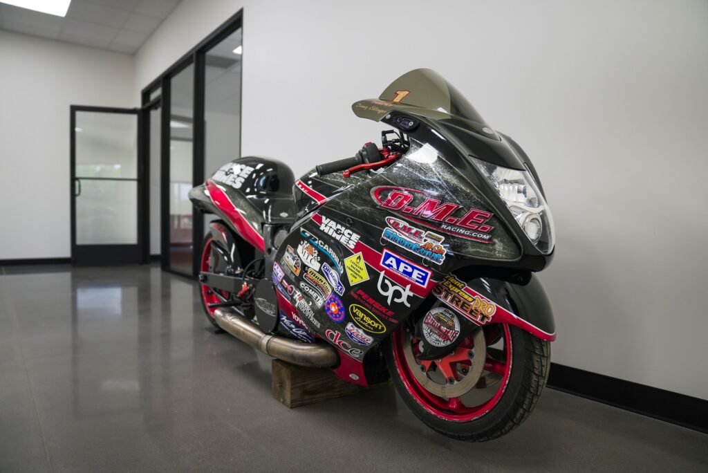 B.M.E. drag racing motorcycle displayed in the showroom